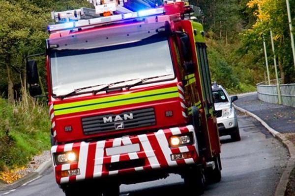 Firefighters dealing with fire at agricultural building in village near York